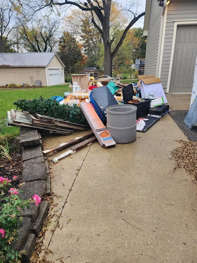 Dumpster being loaded with debris for 12 Yard Dumpster Rental in Margate City